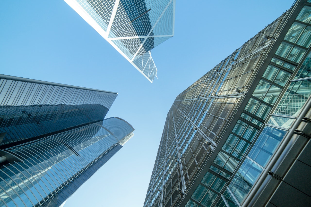 looking up at skyscrapers